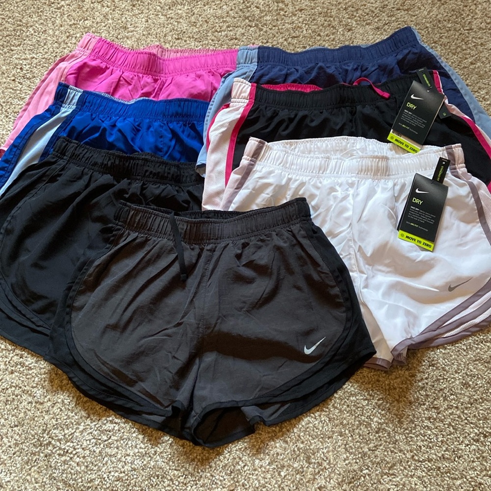 7 pair of Nike running shorts